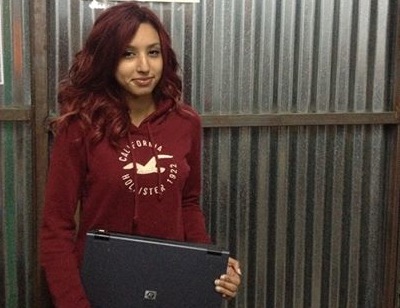 Young Mother Ensuring Her Daughters Gain Computer Literacy