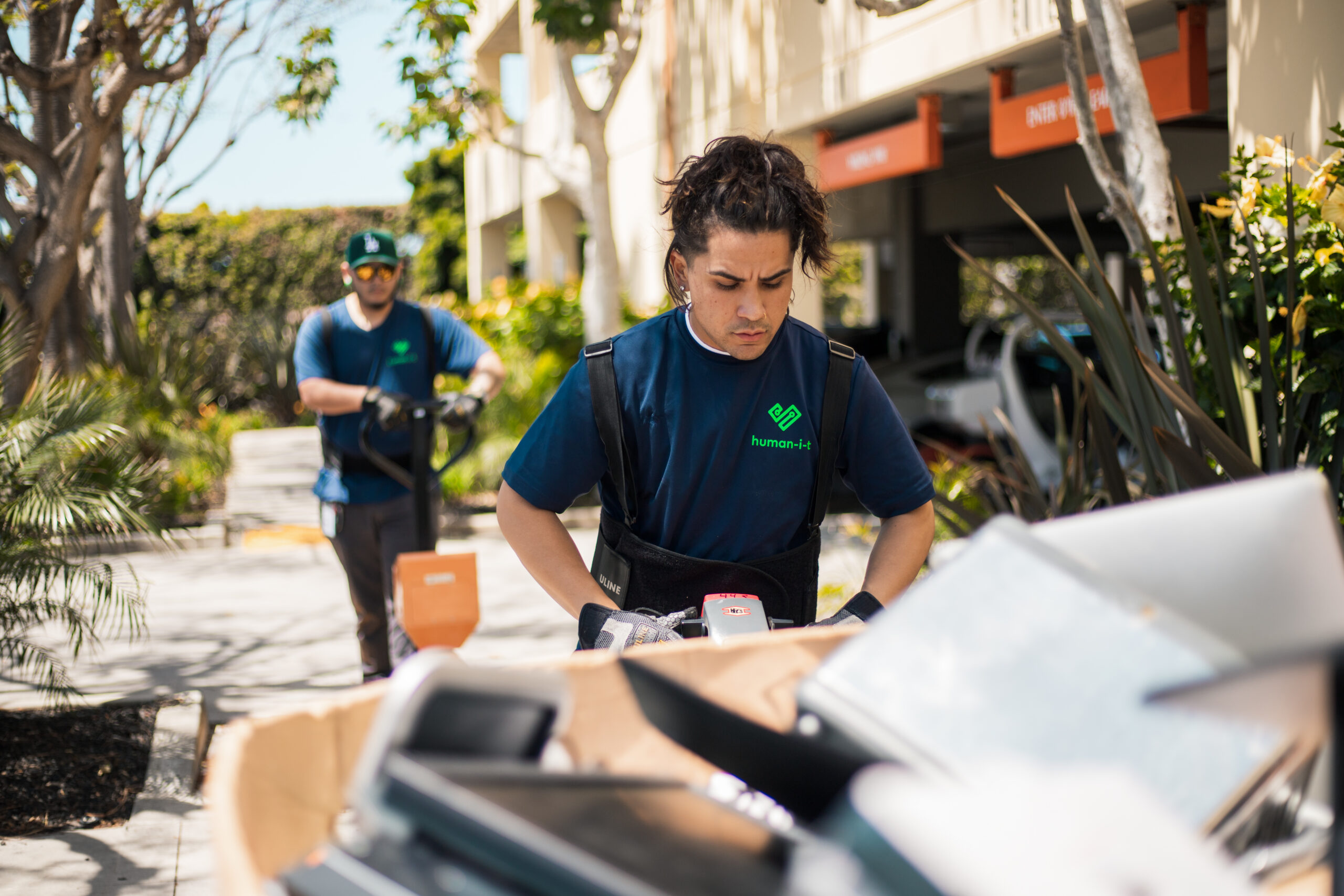 Human-I-T staff performing mission-critical, audit-ready ITAD work in support of sustainability and community impact